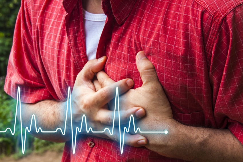Men in red shirt having chest pain – heart attack – heartbeat line